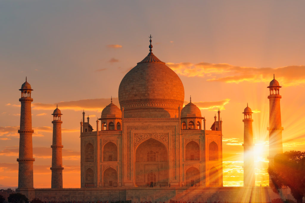 the Taj Mahal, India glowing red with the sun low in the sky