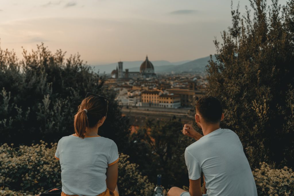 young woman and man viewing the Florence skyline from a hill