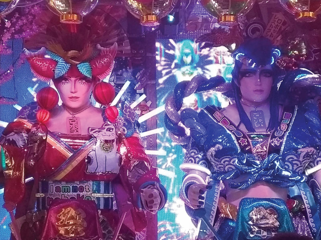 pair of humanoid robots dressed in colourful Japanese-inspired clothes at the Robot Restaurant, Tokyo