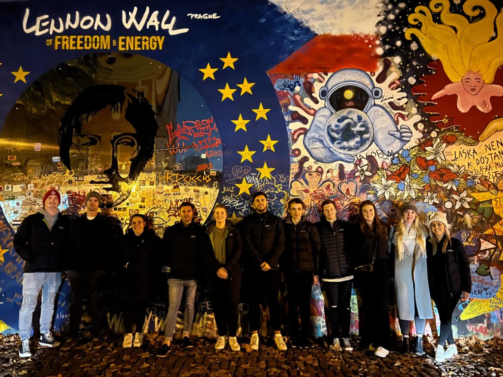 group of travellers in front of John Lennon Wall