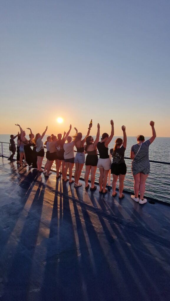 A Topdeck trip group gazing at the sunset 